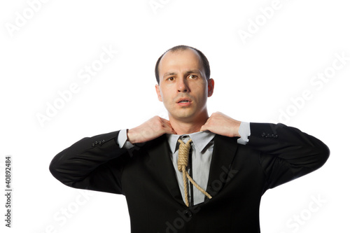 Photo: Businessman with gallow tie suffocating and trying to free himse Businessman with gallow tie suffocating and trying to free himse