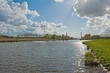 Bridge over a sunlit canal in spring