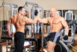 Bodybuilders shake each others hands at the gym after a workout