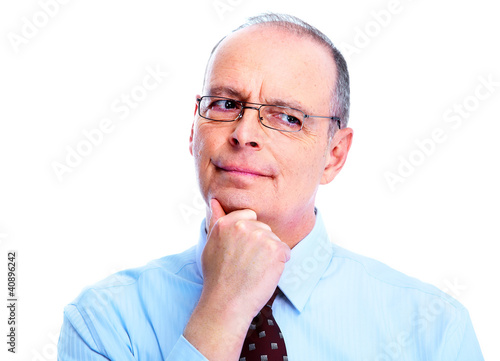 Photo: Skeptical businessman. Skeptical businessman.