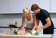 couple in their kitchen making dinner
