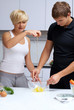 couple in their kitchen making dinner