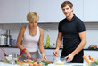couple in their kitchen making dinner