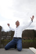 Casual man with arms wide open