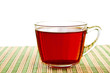 Teacup on straw napkin.
