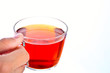 Teacup in hand on white background
