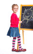 Photo: Little girl draws on the board Little girl draws on the board
