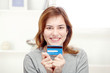Happy young woman holding credit card Happy young woman holding credit card