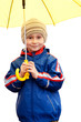 Cute boy with yellow umbrella