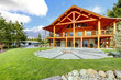Beautiful American classic log cabin with porch.