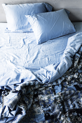 Photo: Unmade bed and bedding Unmade bed and bedding