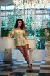 Foto: Beautiful woman near a piano. Beautiful woman near a piano.