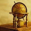 Globe standing on a vintage book. Globe standing on a vintage book.