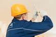 Electrician at cable wiring work