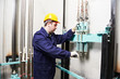 machinist with spanner adjusting lift mechanism