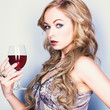 Beautiful blond woman with glass red wine