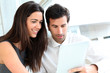 Business people websurfing on tablet during breaktime