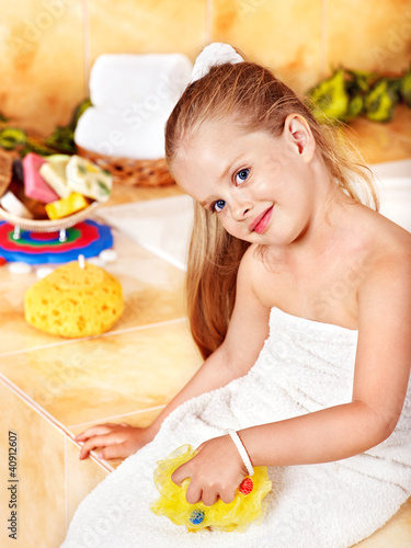 Photo: Child washing in bubble bath . Child washing in bubble bath .