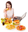 Woman eating junk food.