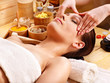 Woman getting  facial massage .