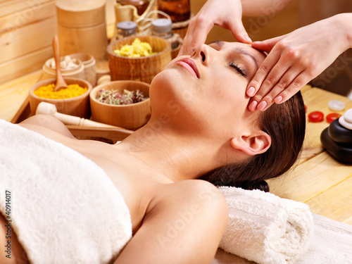 Photo: Woman getting facial massage . Woman getting facial massage .
