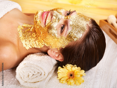Photo: Woman getting facial mask . Woman getting facial mask .
