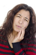 young women feel tooth pain, and holds the cheek bone young women feel tooth pain, and holds the cheek bone