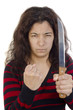 aggressive young woman with a clenched fist and a kitchen knife aggressive young woman with a clenched fist and a kitchen knife