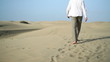 Young man walking in the desert