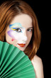 Beautiful redhead girl with make-up.