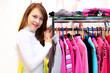 Young woman inside a store buying clothes