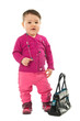 Baby girl in pink posing with hand bag over white Baby girl in pink posing with hand bag over white