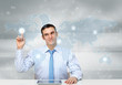 Business person against technology background