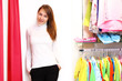 Young woman inside a store buying clothes