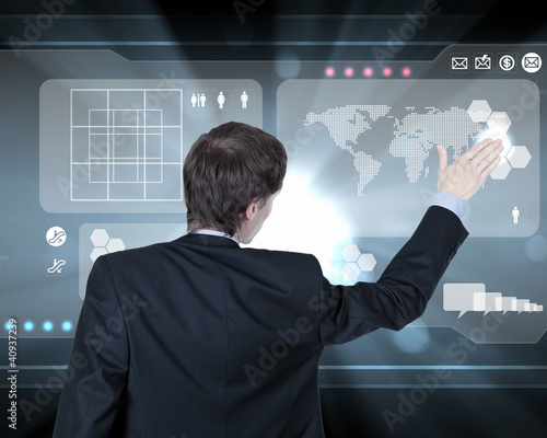 Illustration: Businessman working with virtual computer screen Businessman working with virtual computer screen