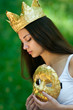 Photo: Sad young woman wearing crown and mask Sad young woman wearing crown and mask