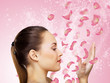 Young woman with flowers on background