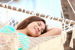 Vacation woman in hammock sleeping Vacation woman in hammock sleeping