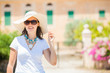 Portrait of cute young woman in summer hat