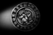 Carved Mayan calendar in dramatic light