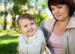 Grandmother with her little granddaghter in park