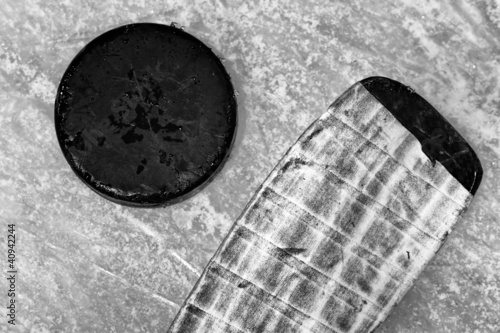 Photo: hockey stick and puck hockey stick and puck