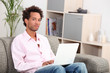 Couple sitting on sofa gray