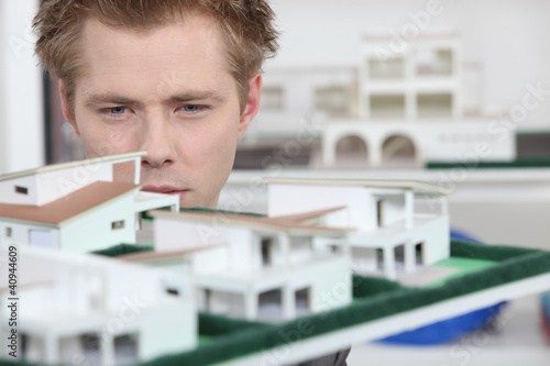 Photo: Property developer inspecting model Property developer inspecting model