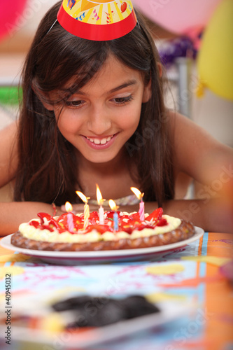 Photo: Girl blowing candles Girl blowing candles