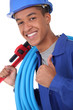 Young plumber with a wrench