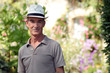 Senior citizen relaxing in his garden