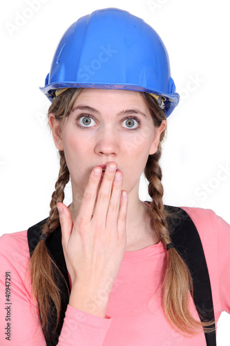 Photo: Embarrassed female builder Embarrassed female builder