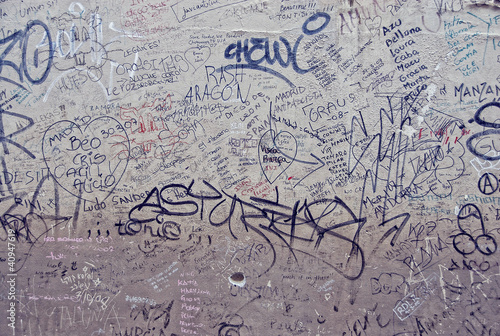 Photo: a wall in italy with graffiti and random writings a wall in italy with graffiti and random writings