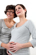 Pregnant daughter stood with mother